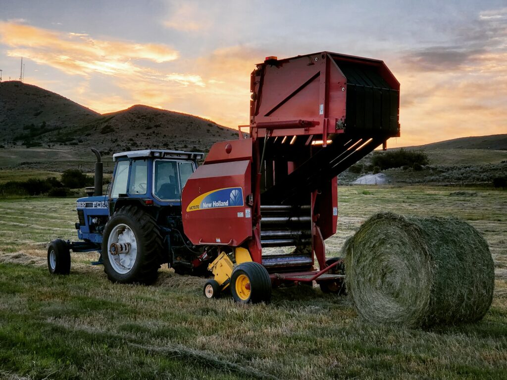 Ford 8630 pulling a New holland BR7070 round baler